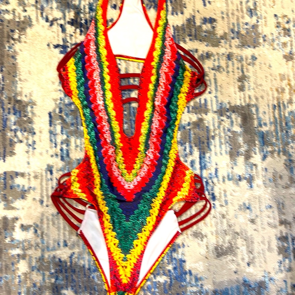 Really cute one piece swim wear. Bob Marley inspired color.